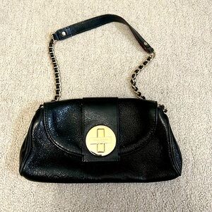 Kate spade back patent shoulder purse with gold hardware and cross lock